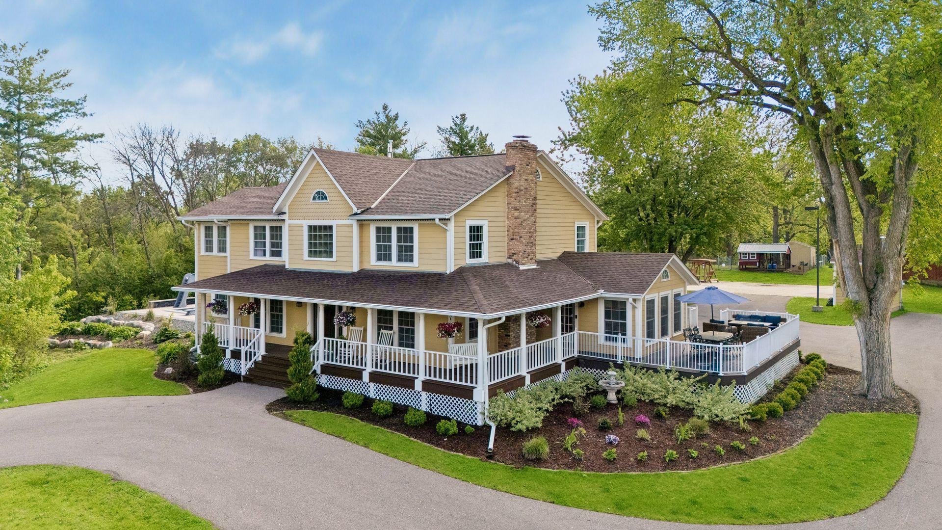 Landscaped beds and spans of level green lawn enhance this large private lot.