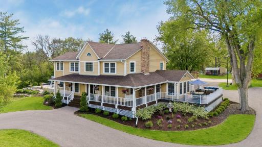 Landscaped beds and spans of level green lawn enhance this large private lot.