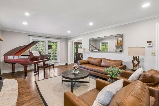 Crown molding adds architectural interest to the room and is highlighted by perimeter recessed lighting.