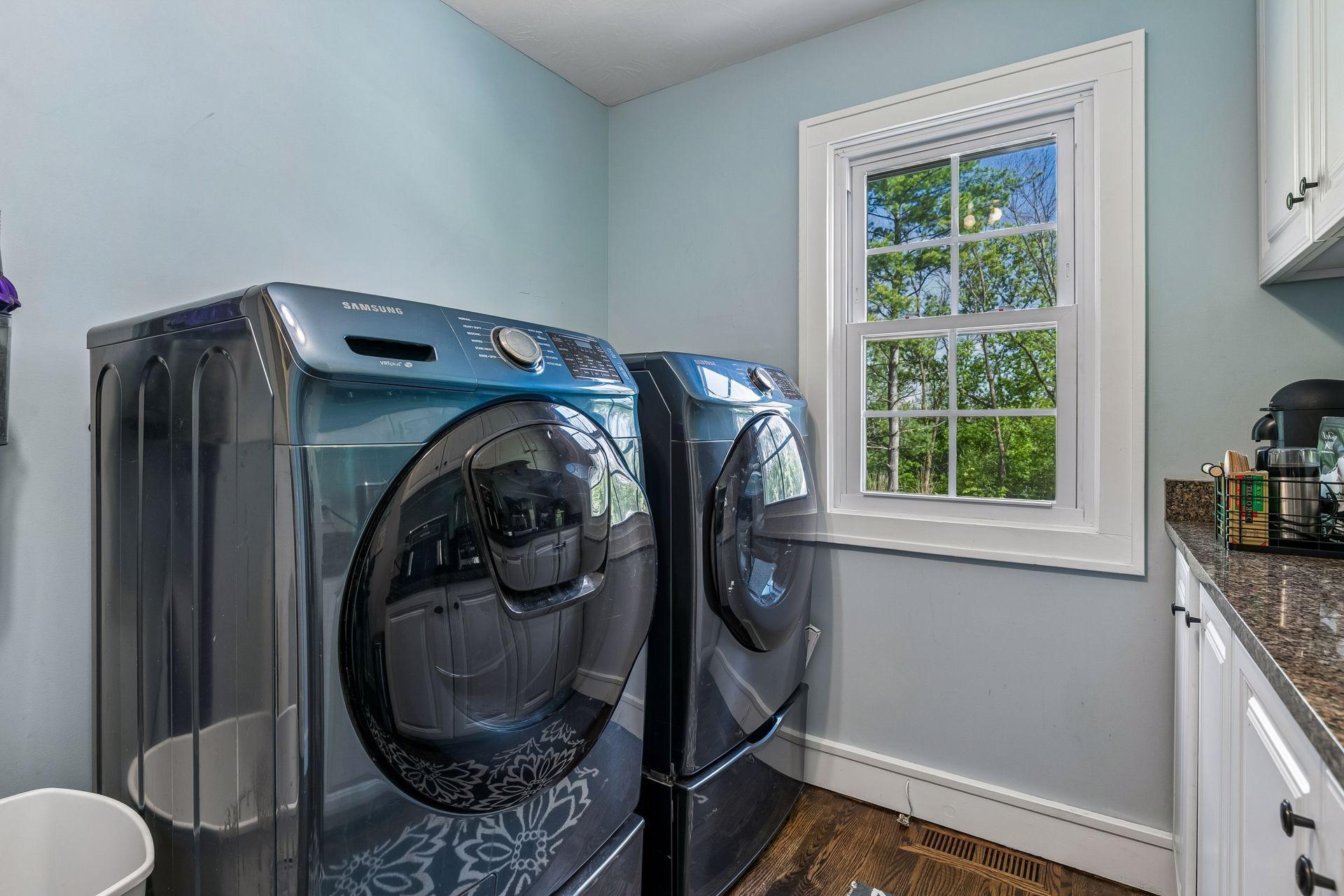 There is a full laundry room on the main floor with cabinets for storage. The primary bedroom closet also has a stacked washer and dryer.