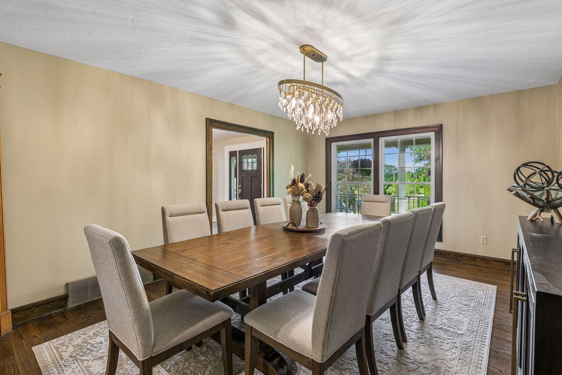 The formal dining room features a dramatic chandelier and is just off the kitchen.