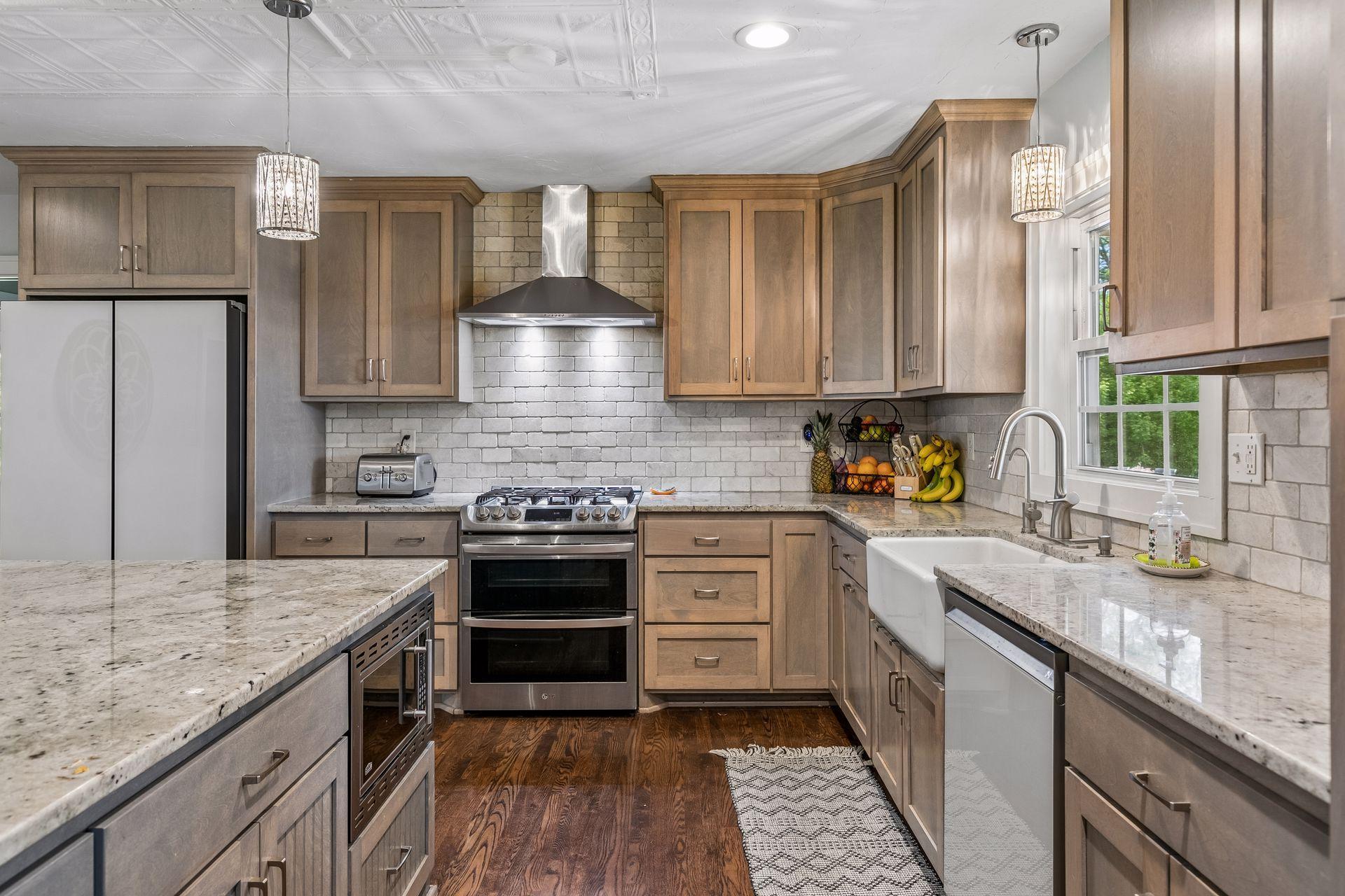 Note the ceiling detail with recessed lights and decorative pendants.