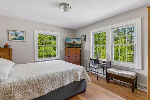 The main-floor office is currently used as a guest room, offering flexible living space.
