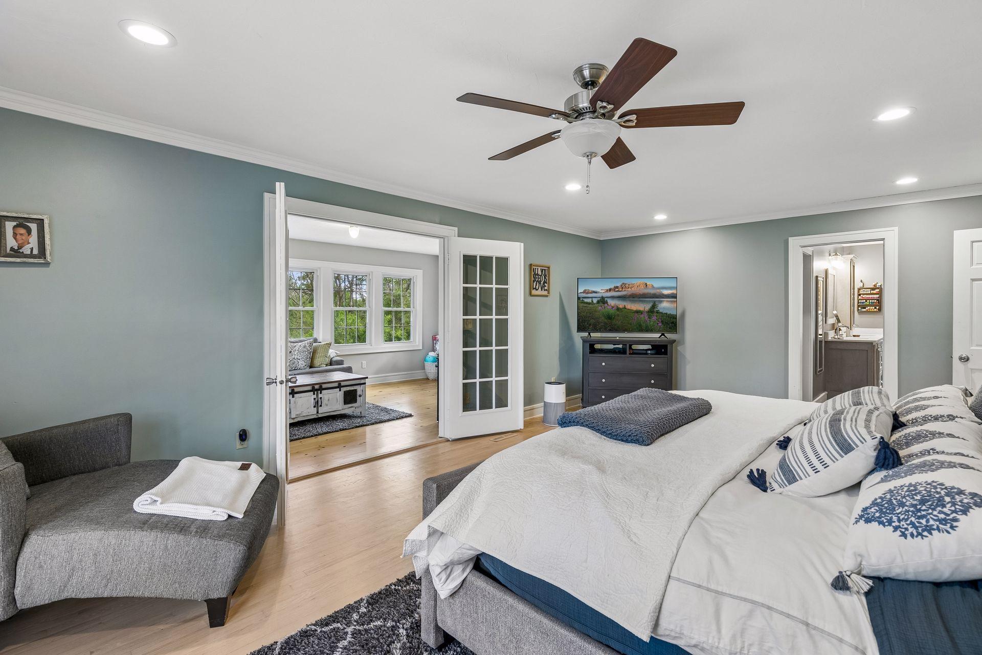 Here you can see the double French doors to the sunroom and to the right is the entrance to the private bath.