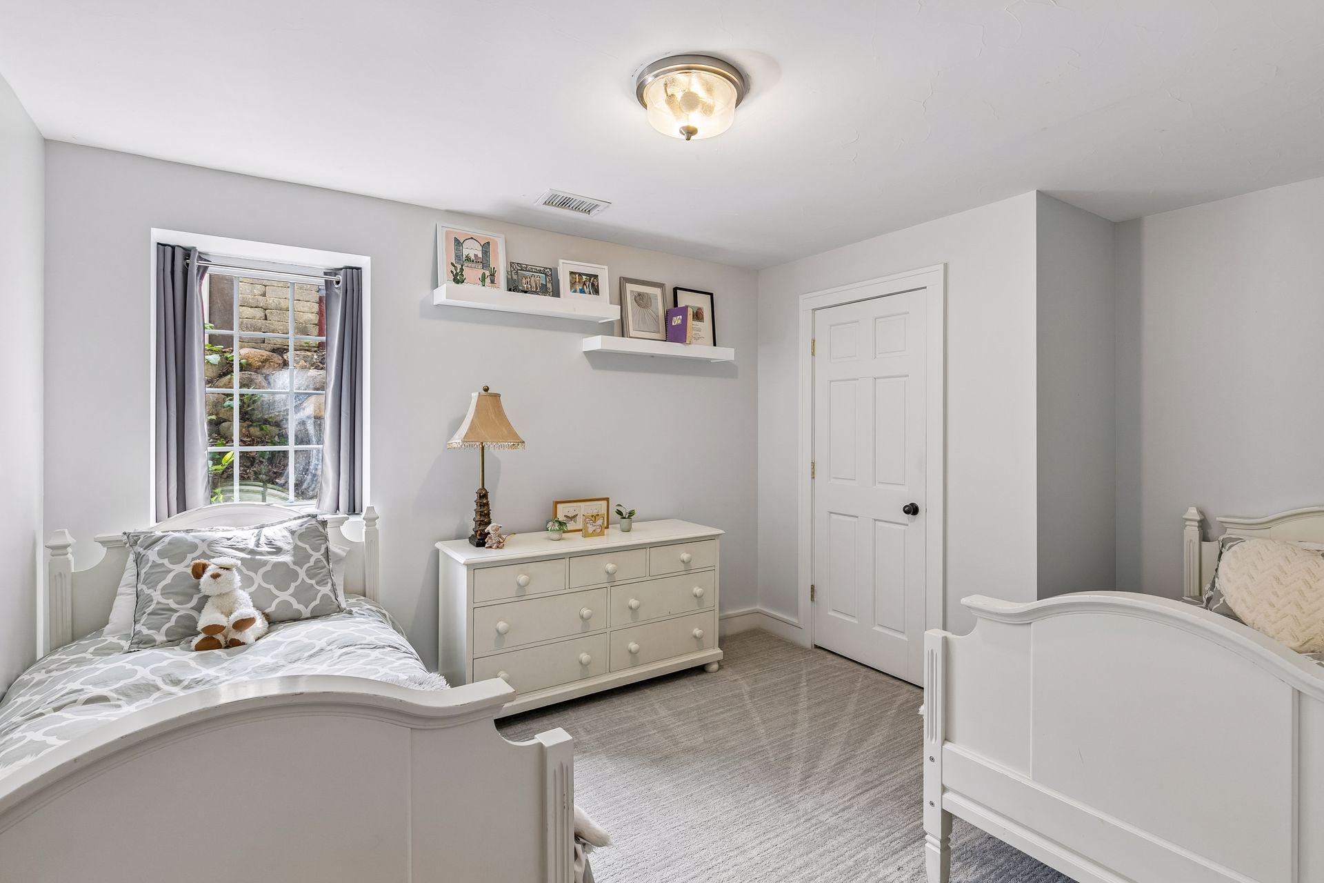 The fourth bedroom in the home is in the lower level. It has a reach-in closet.