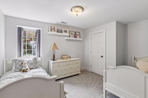 The fourth bedroom in the home is in the lower level. It has a reach-in closet.