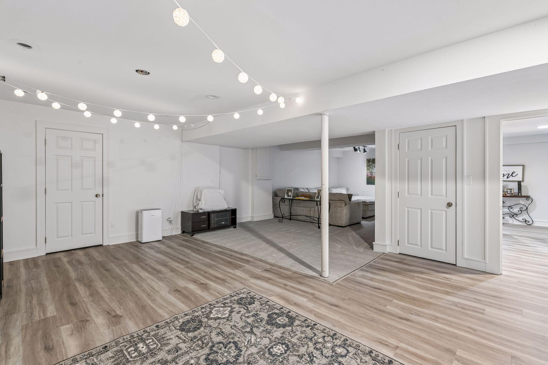 There is a portion of the room utilized as a media area and a large space with many possibilities.