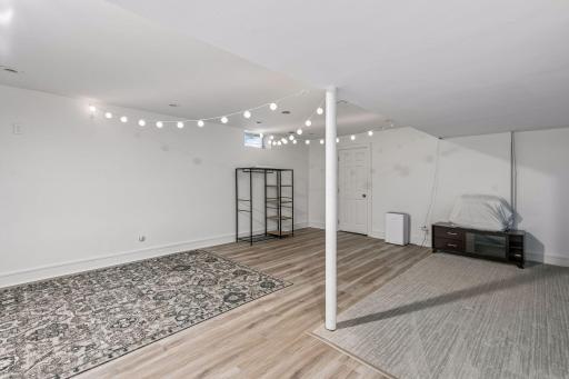 The lower-level family room offers a spacious, flexible layout ideal for relaxing or entertaining.