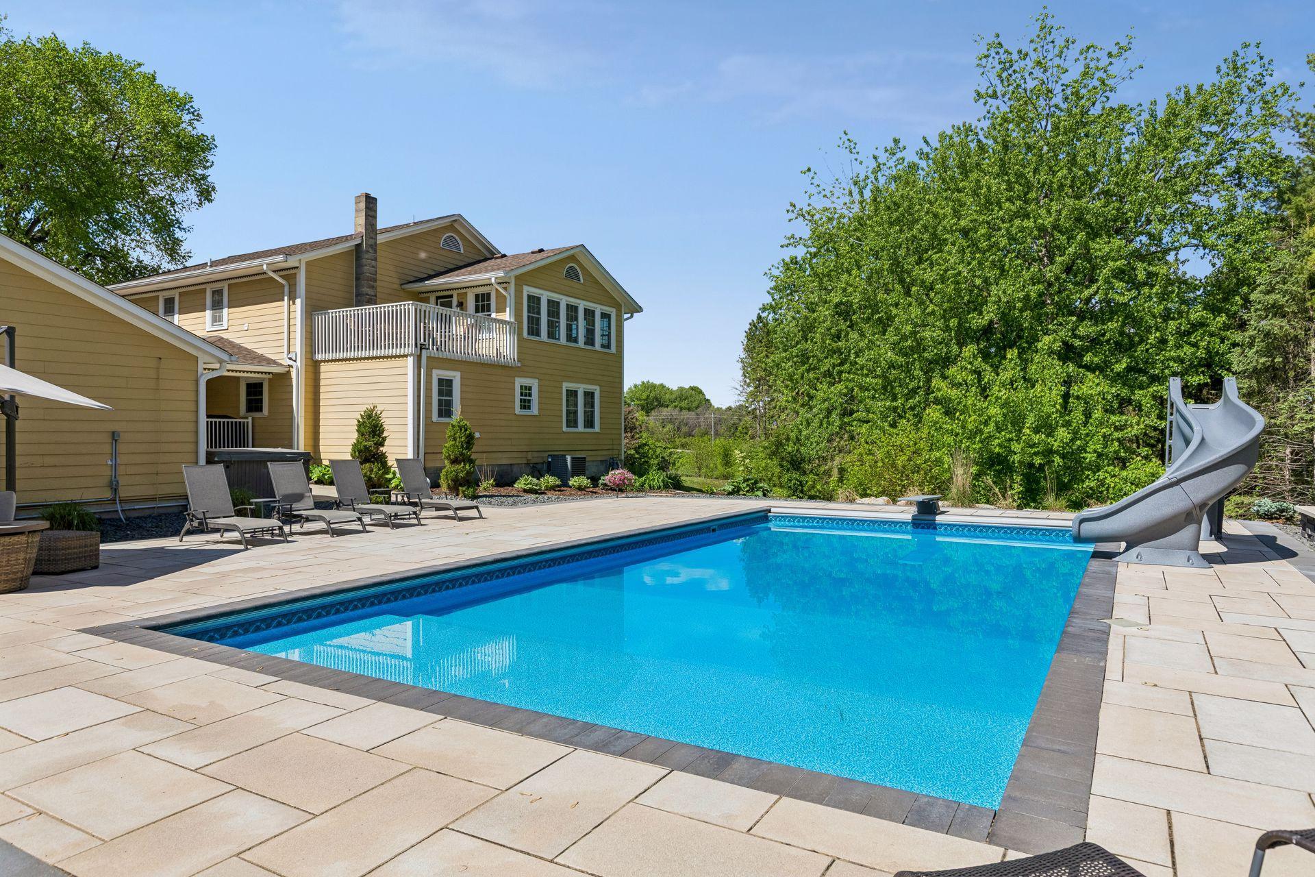 The 40x20 pool is surrounded by a stone patio large enough for big gatherings and perfect for quiet nights at home.