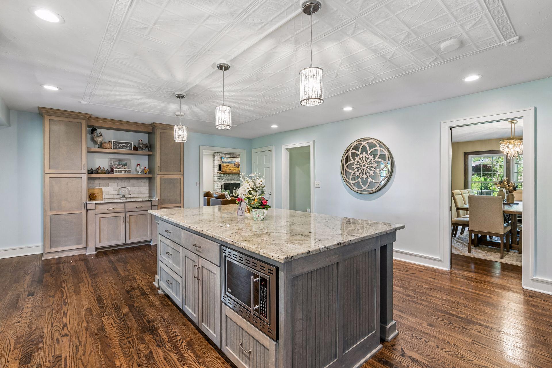 The kitchen can be accessed from the living room, hallways and dining room as well as the rear mudroom entrance.