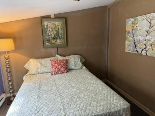 The second bedroom is located at the back of the house overlooking the backyard.