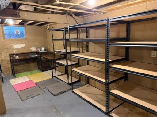 Basement offers plenty of room for storage and office area!