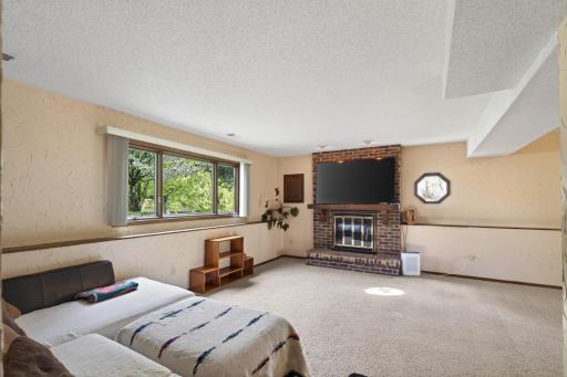 lower level living area with wood burning fireplace