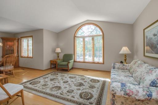 Main level family room with vaulted ceilings and gorgeous front window.