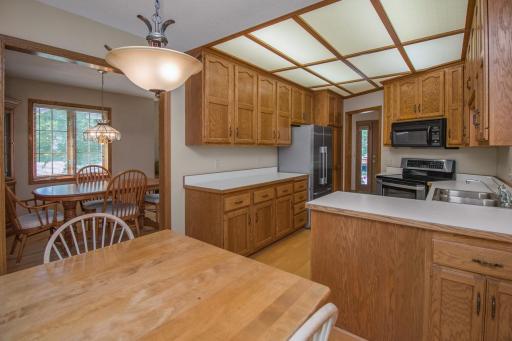 Informal dining and kitchen with lots of counterspace and cabinets.