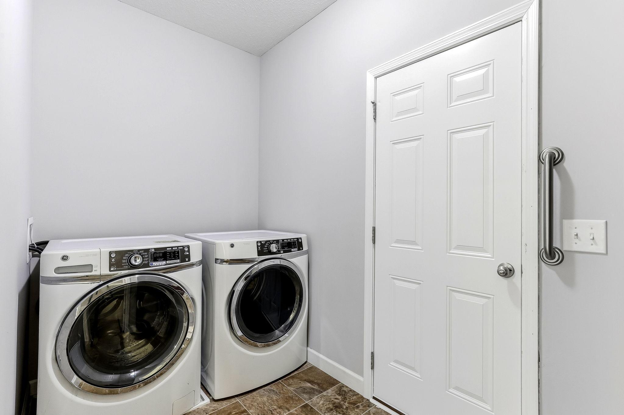 Convenient main-level laundry featuring a bright, organized space designed for everyday ease.