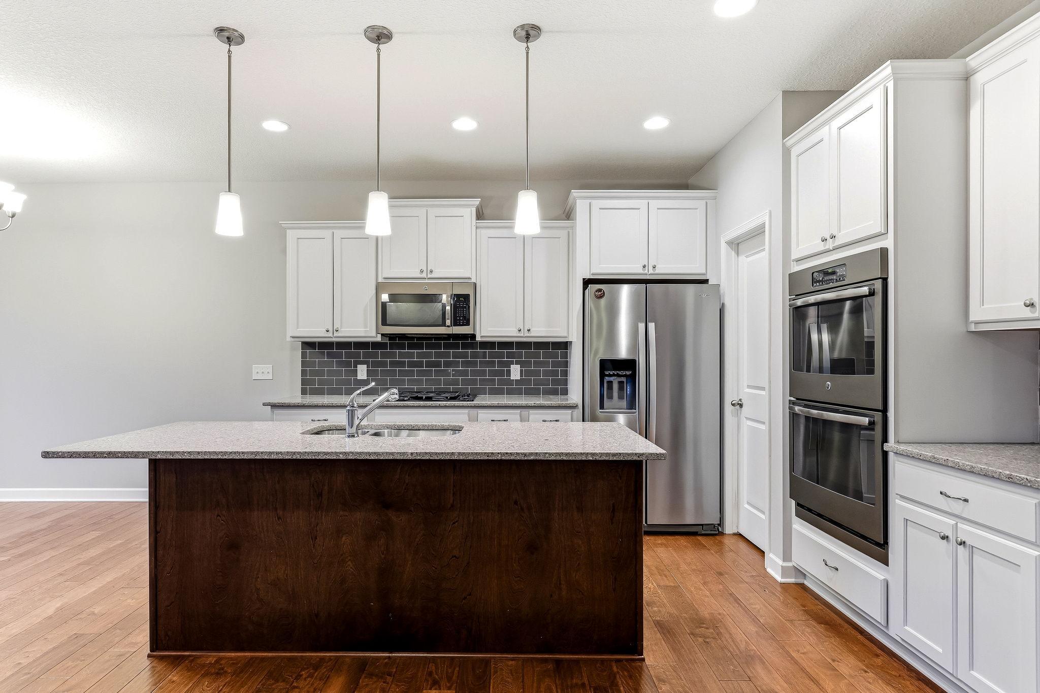 Sleek stainless steel appliances add a polished, modern touch to the kitchen.