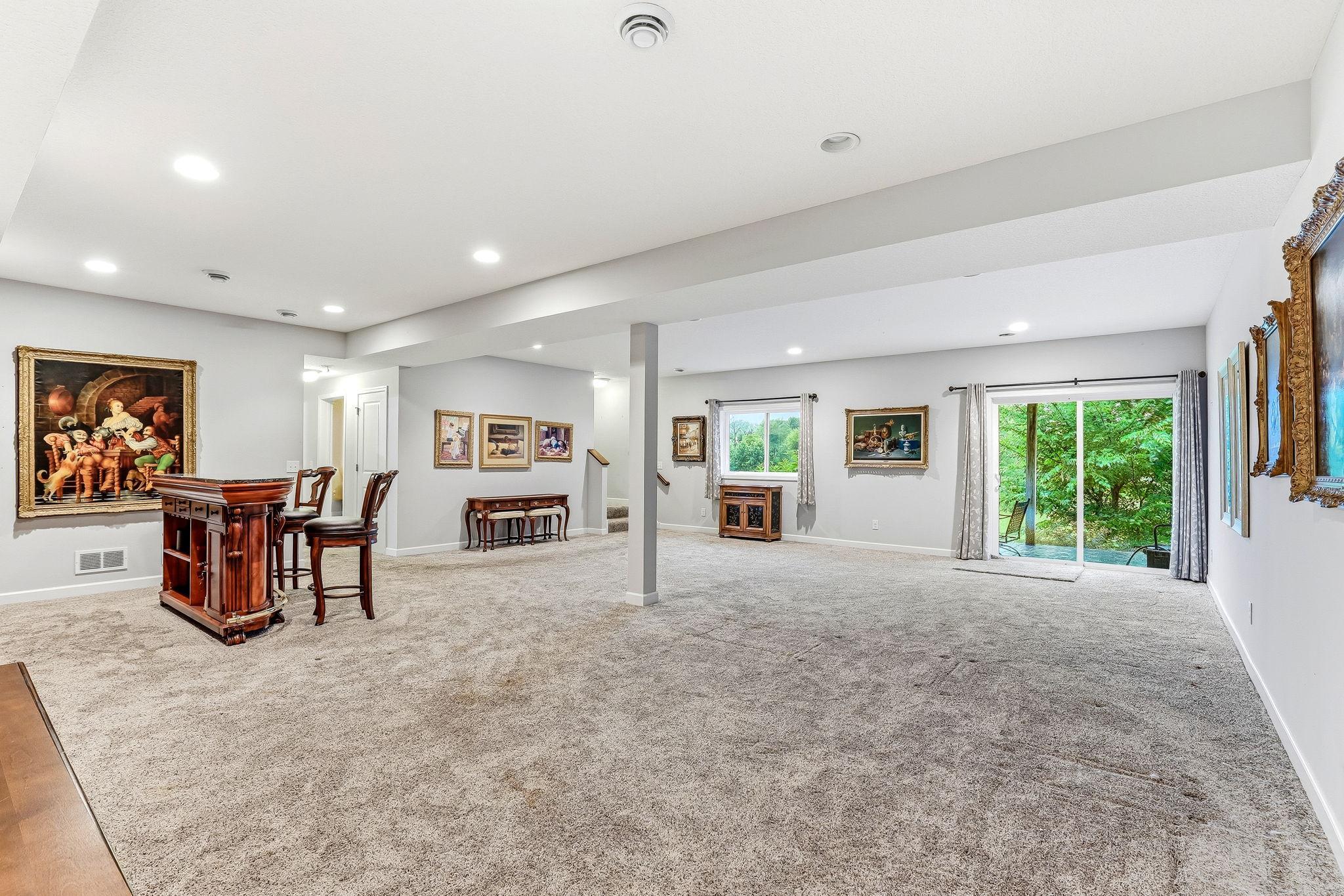 A bright, inviting walkout lower level that expands the home’s living space with easy access to the lower level patio.