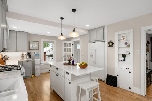 So much space and character in this kitchen with niche built-in and center island offering snack bar seating