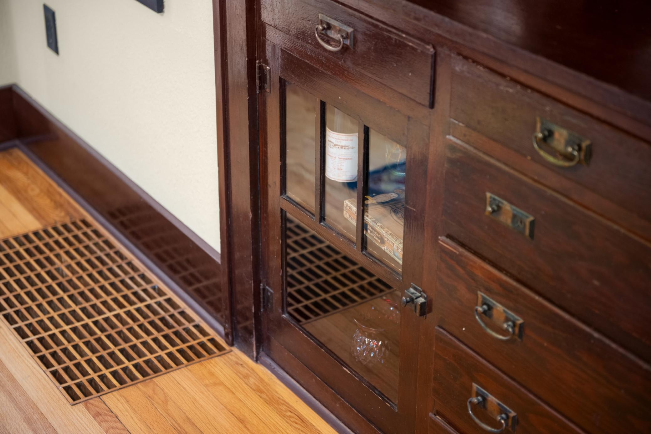 The 1920's dining room built-in with leaded glass doors, drawers, and display cabinetry