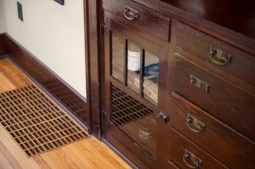 The 1920's dining room built-in with leaded glass doors, drawers, and display cabinetry