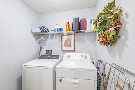3 year old washer dryer in bright Laundry room