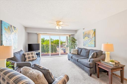 Living room with large sliding glass door to deck