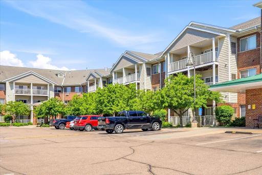 Front of building, unit is just above blue truck