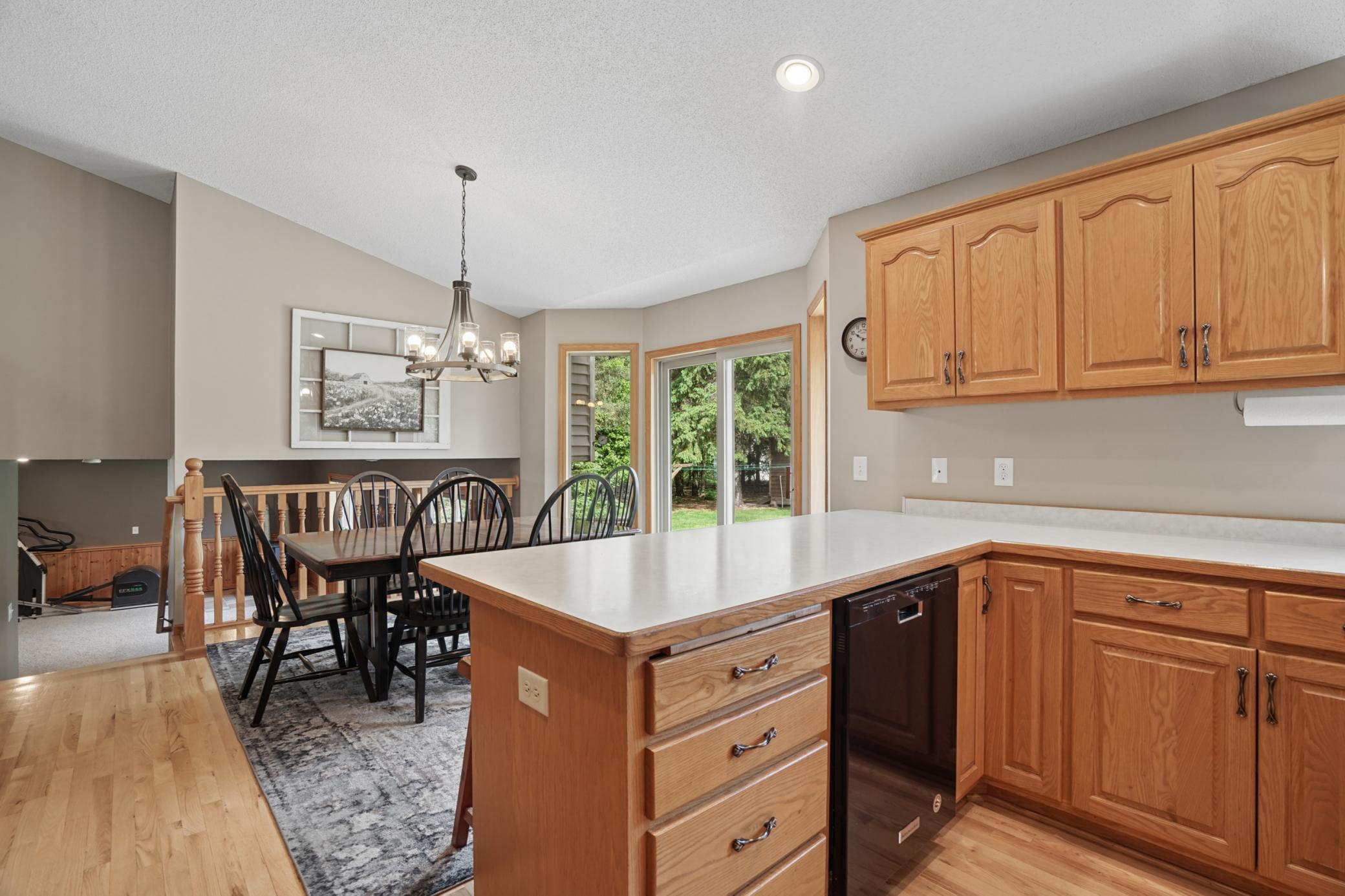 Kitchen/dining area is also open to the lower family room area... makes a great layout for hosting gatherings