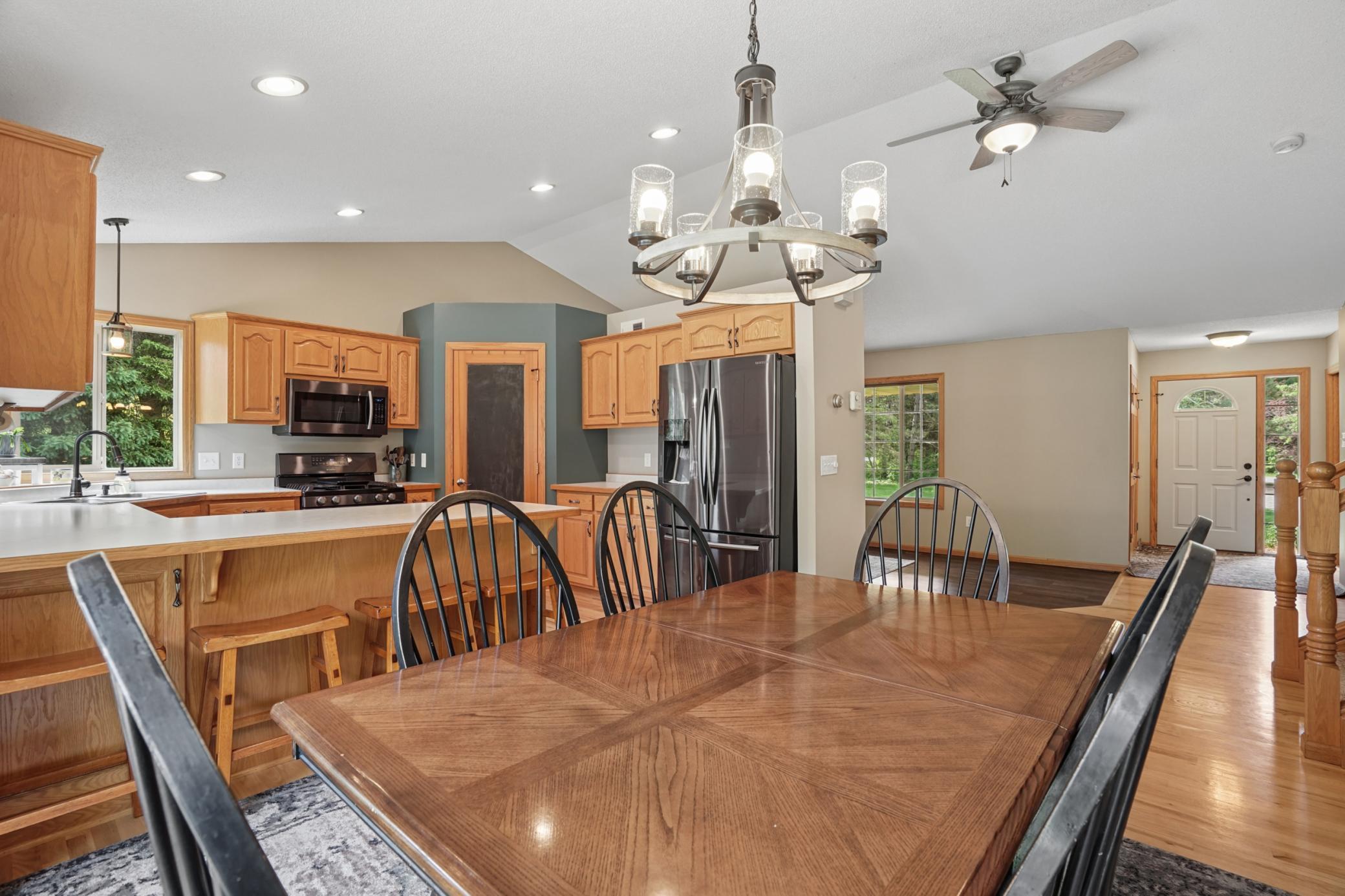 Dining area is spacious and open with updated lighting