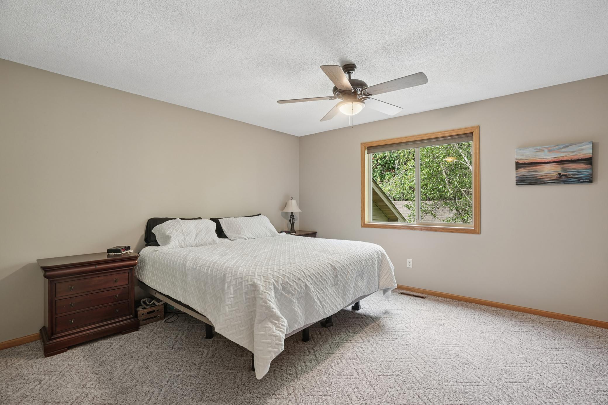 Spacious primary bedroom with large walk-in closet and walk-thru full bath.. this space is very roomy and can host a king sized bed easily!
