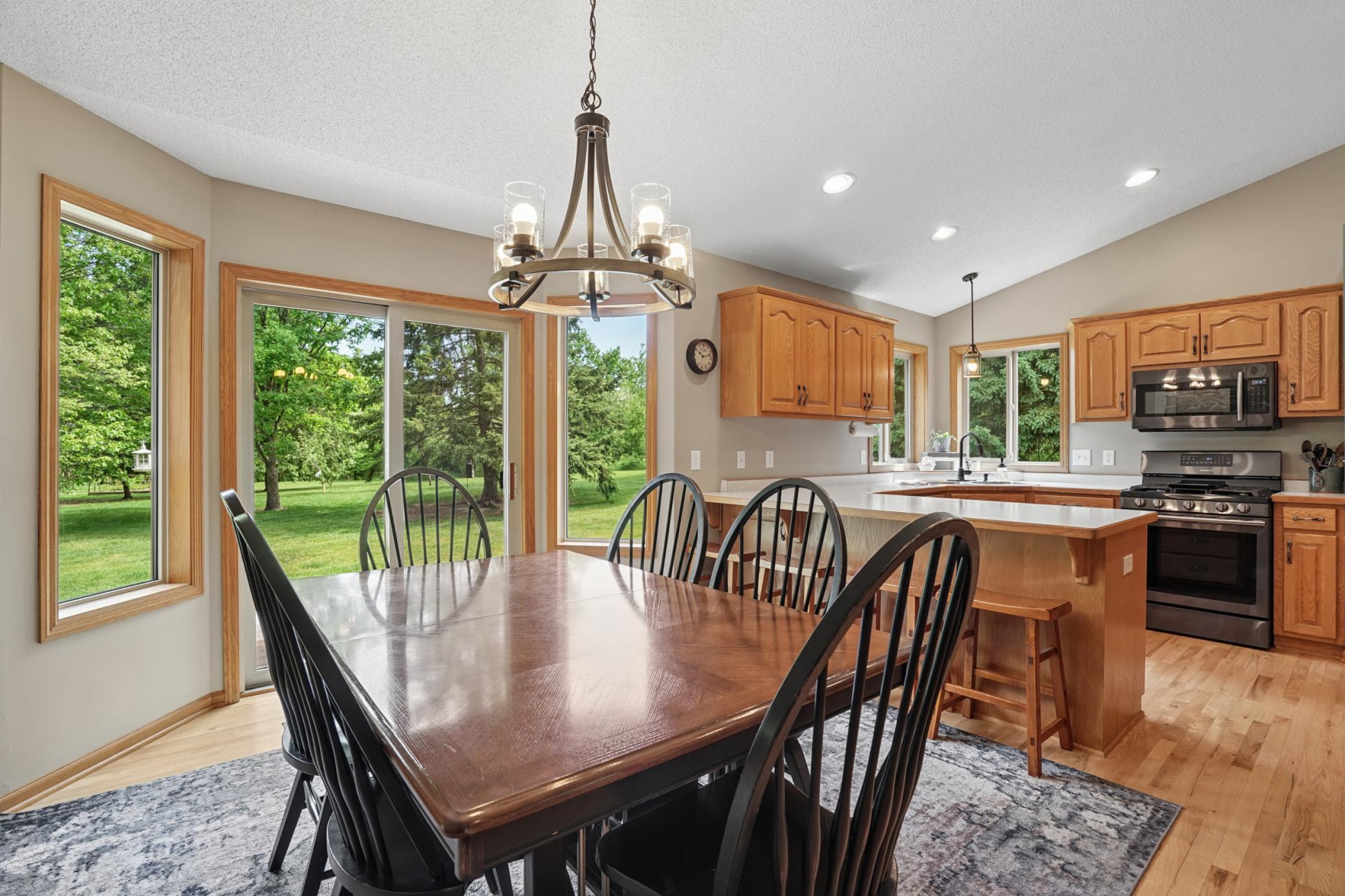 A gorgeous view of the private backyard!!! The slider door opens to the sprawling backyard and patio!