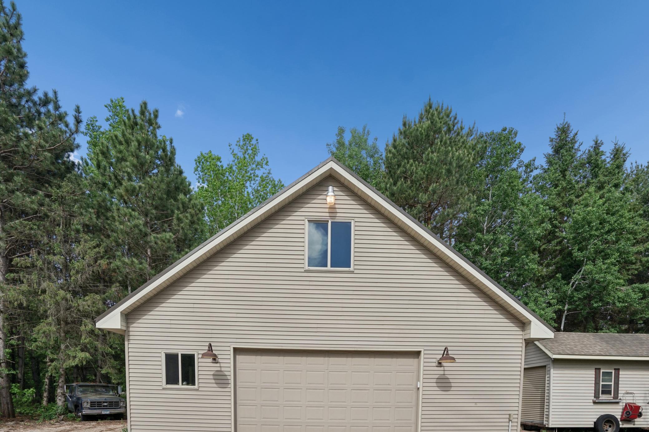 34x32 detached garage with concrete floor and electric! There is also upper level loft space!