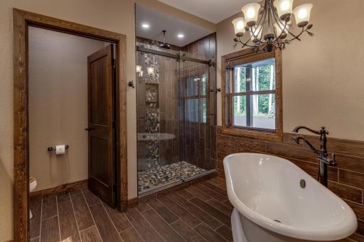 Step into luxury with a spacious walk-in shower designed for ultimate relaxation. And heated floors for those chilly mornings