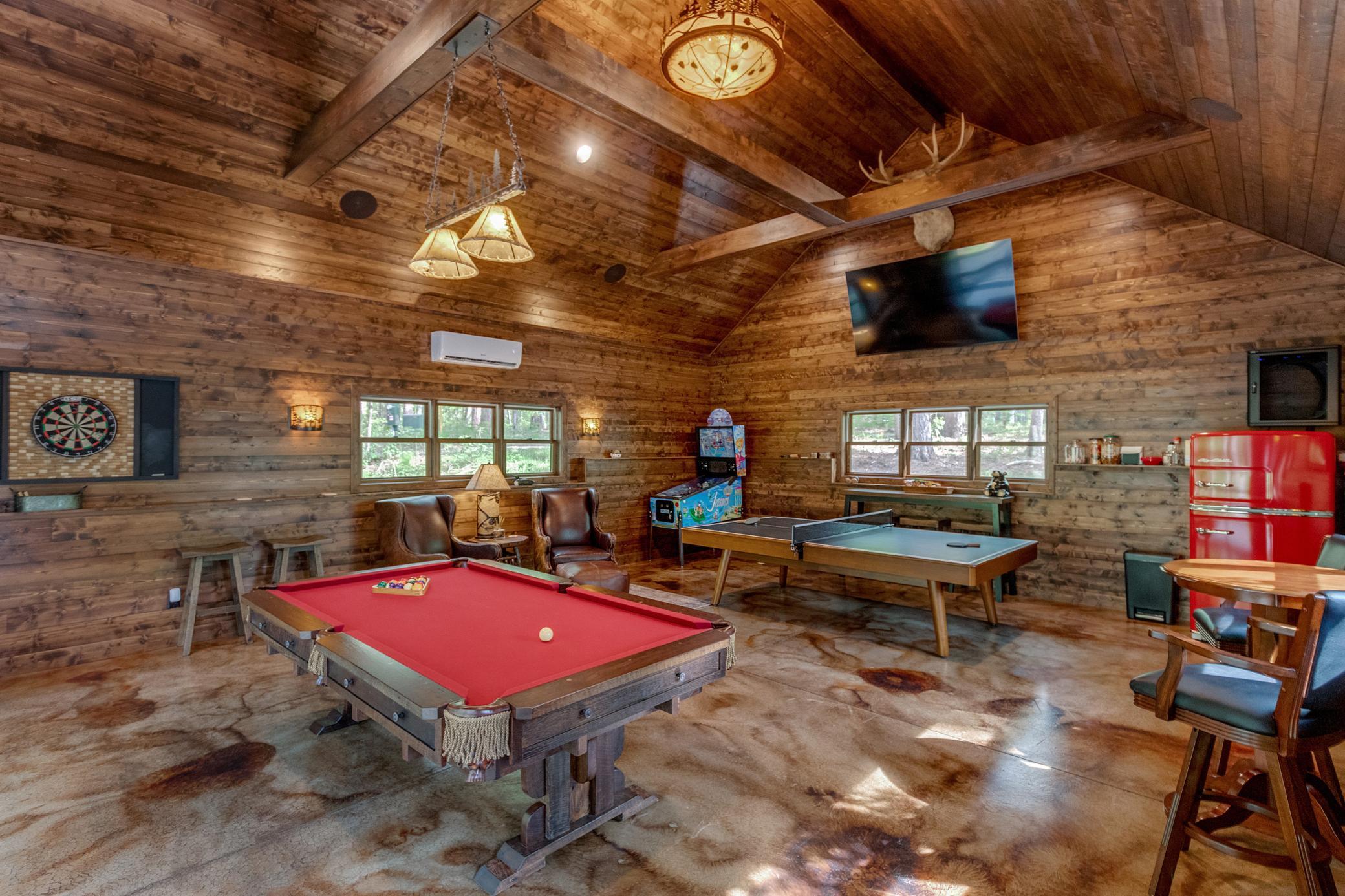 Moose lodge can easily be transformed from a priavate retreat of games and laughter into a luxury garage.