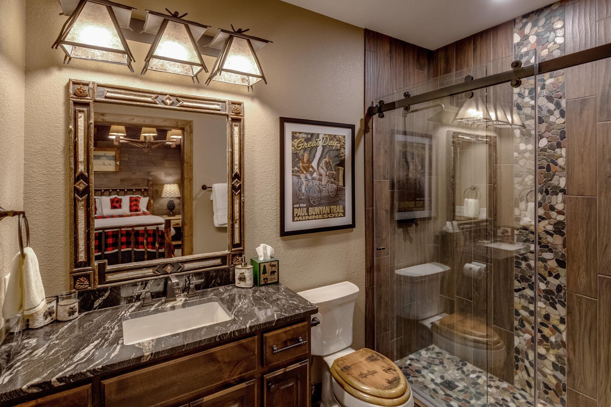 Conveniently connected bathroom with modern fixtures, perfect for the downstairs bedrooms.