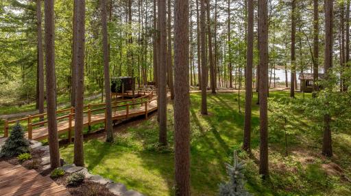 Take a stroll through nature on your own boardwalk path, with serene lake views peeking through the trees.