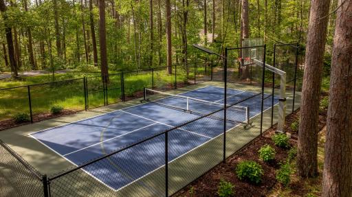 Enjoy an active, resort-inspired lifestyle on the lighted pickleball/tennis court, designed for friendly competition. Permits already in place for future enclosure, the possibilities are endless