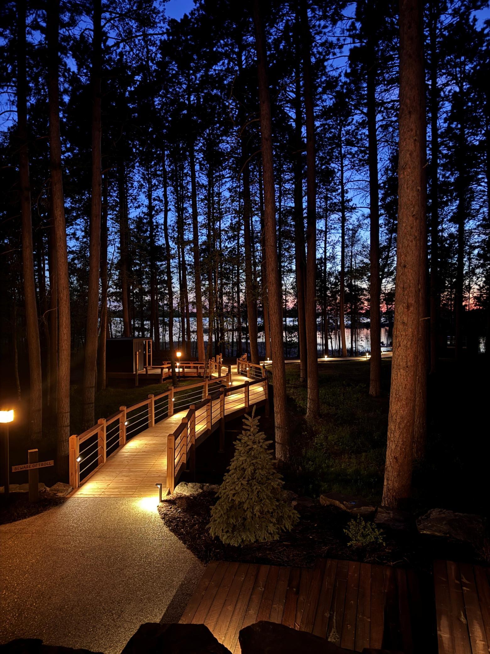 Experience tranquility after dark with beautifully illuminated boardwalk paths.