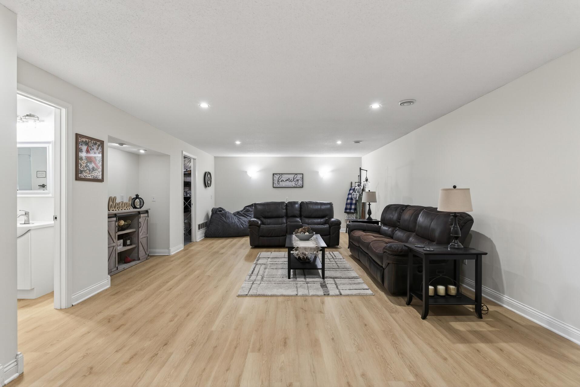Basement family room with alcove.
