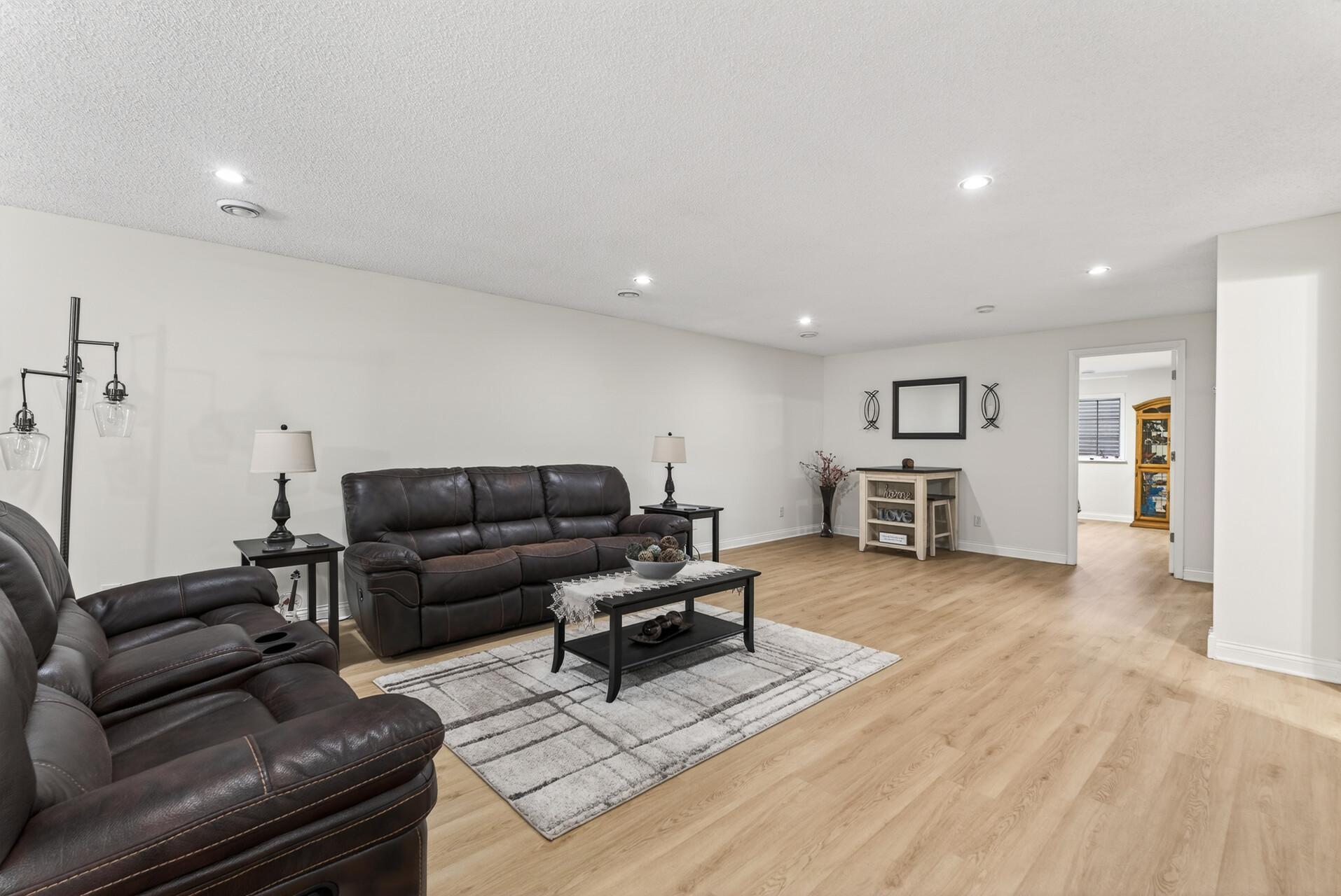 Luxury vinyl plank flooring and ample lighting.