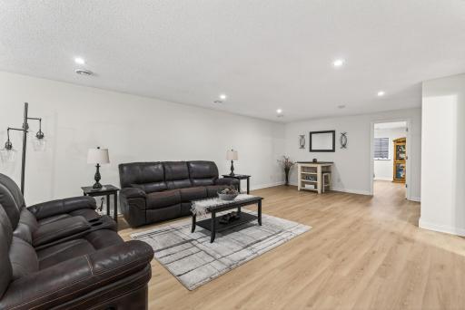 Luxury vinyl plank flooring and ample lighting.