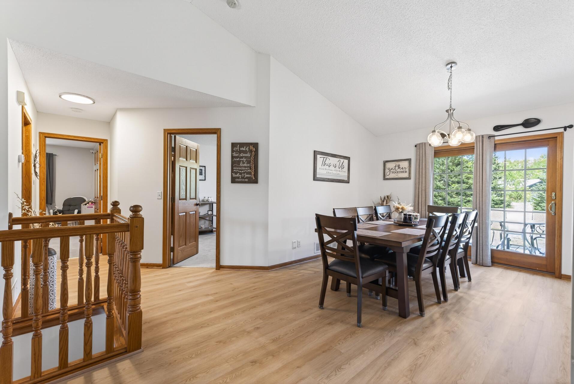 The dining room offers free-flowing space from indoors to outdoors via the patio door.