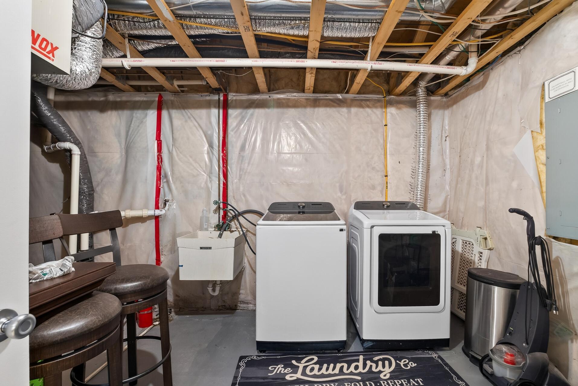 Laundry room/utility/storage room in the basement.