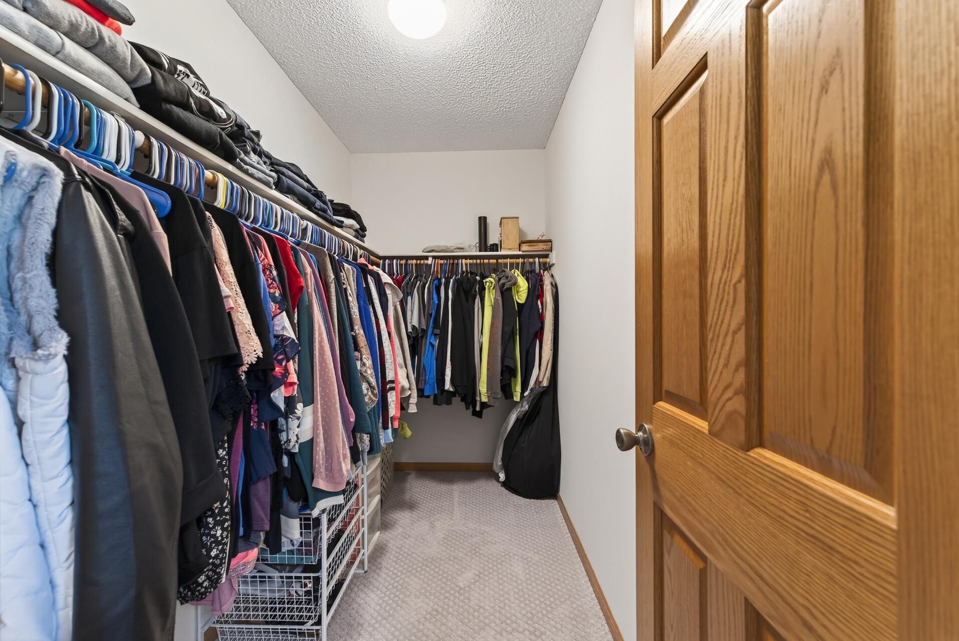 Primary bedroom walk-in closet.