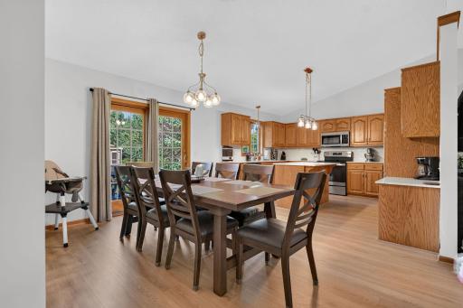 The dining room offers free-flowing space from indoors to outdoors via the patio door.