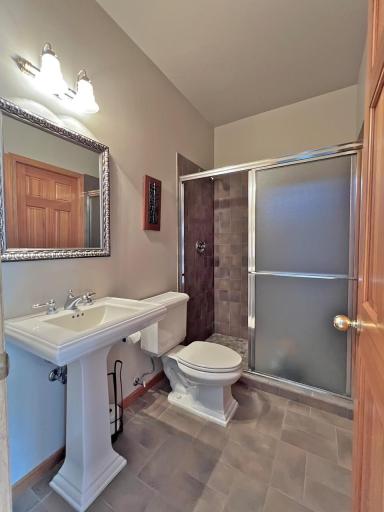 Additional main floor 3/4 bathroom with walk in shower