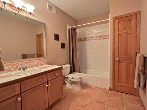 Additional spacious tiled full bathroom in lower level