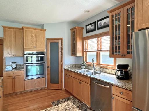 Spacious kitchen featuring granite countertops, extensive cabinetry & stainless steel appliances