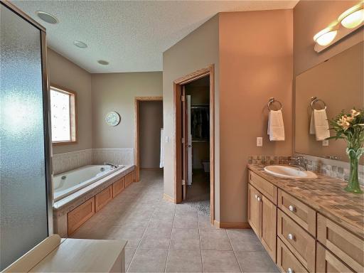 Another view of primary bathroom w/separate tub and shower